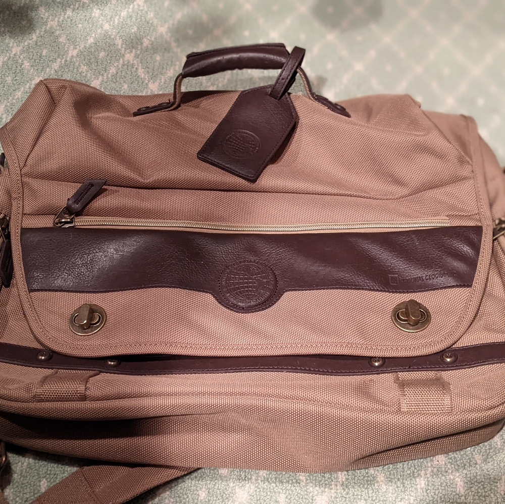 National Geographic canvas messenger bag with leather logo and luggage tag.